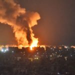 A fire plume rising above a Beirut neighbourhood